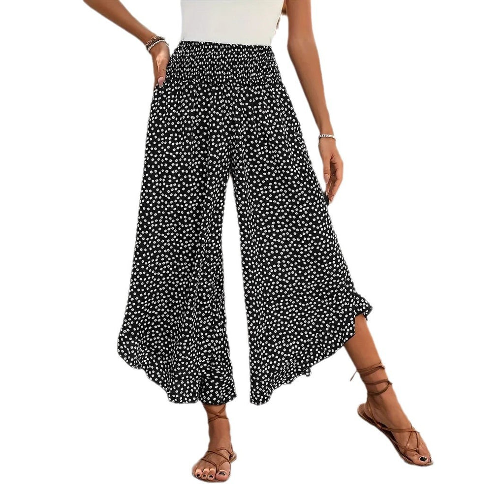 Pantalon palazzo noir à pois blancs pour femme sur fond blanc